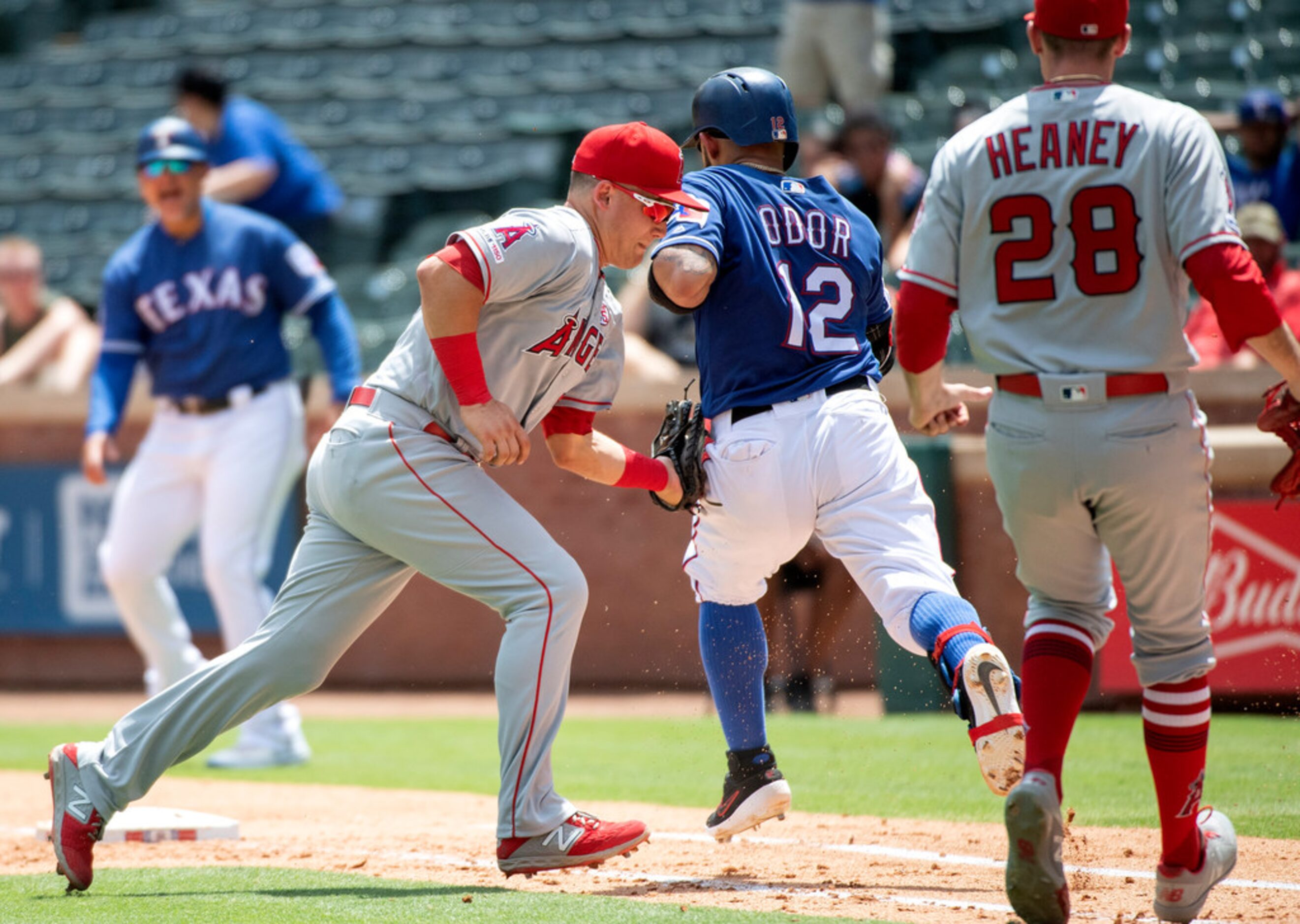 Los Angeles Angels first baseman Matt Thaiss tags out Texas Rangers' Rougned Odor (12) on a...