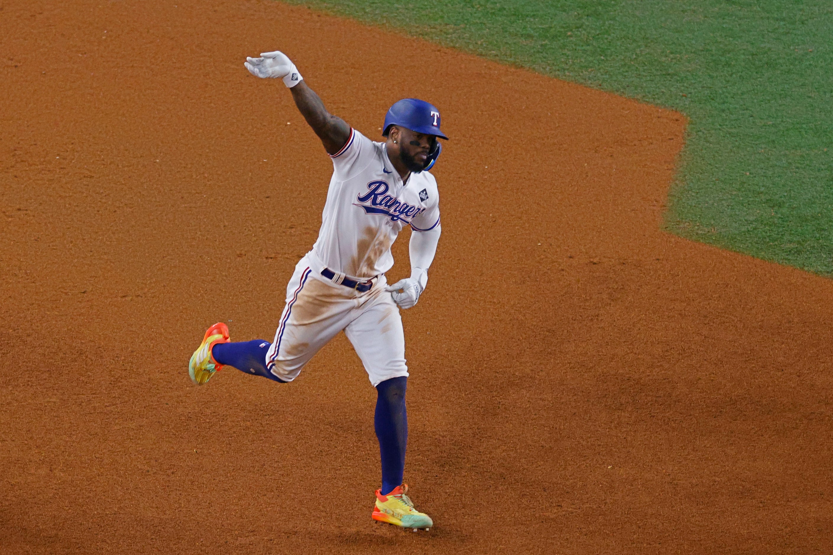 Texas Rangers right fielder Adolis Garcia (53) waves after hitting a winning home run during...