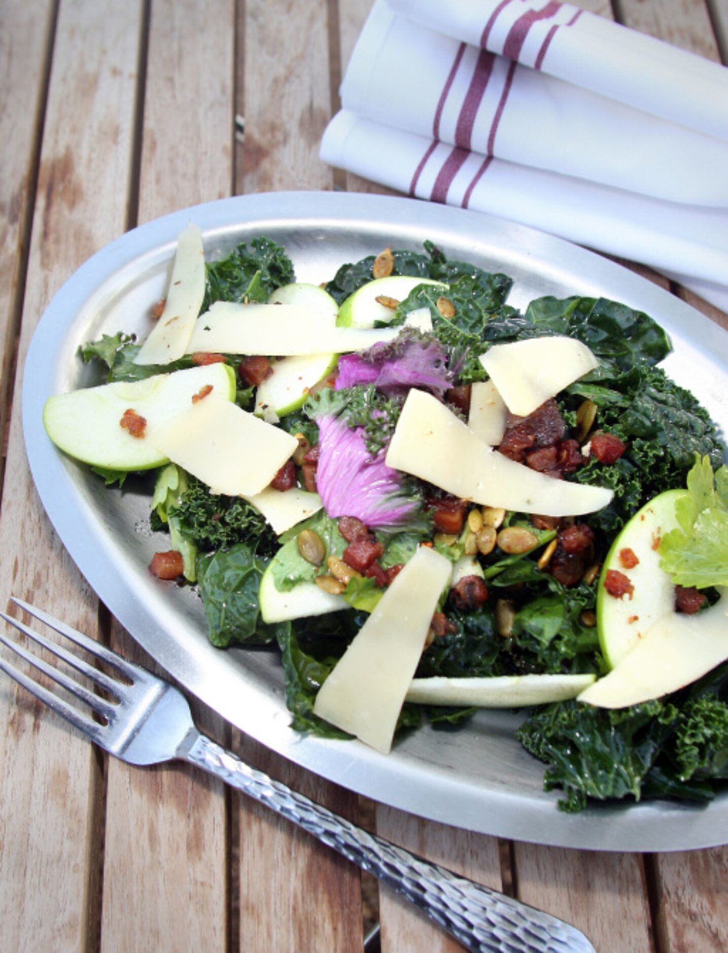 WOODSHED SMOKEHOUSE: A three kale salad with celery leaves, guanciale, smoked pepitas and...