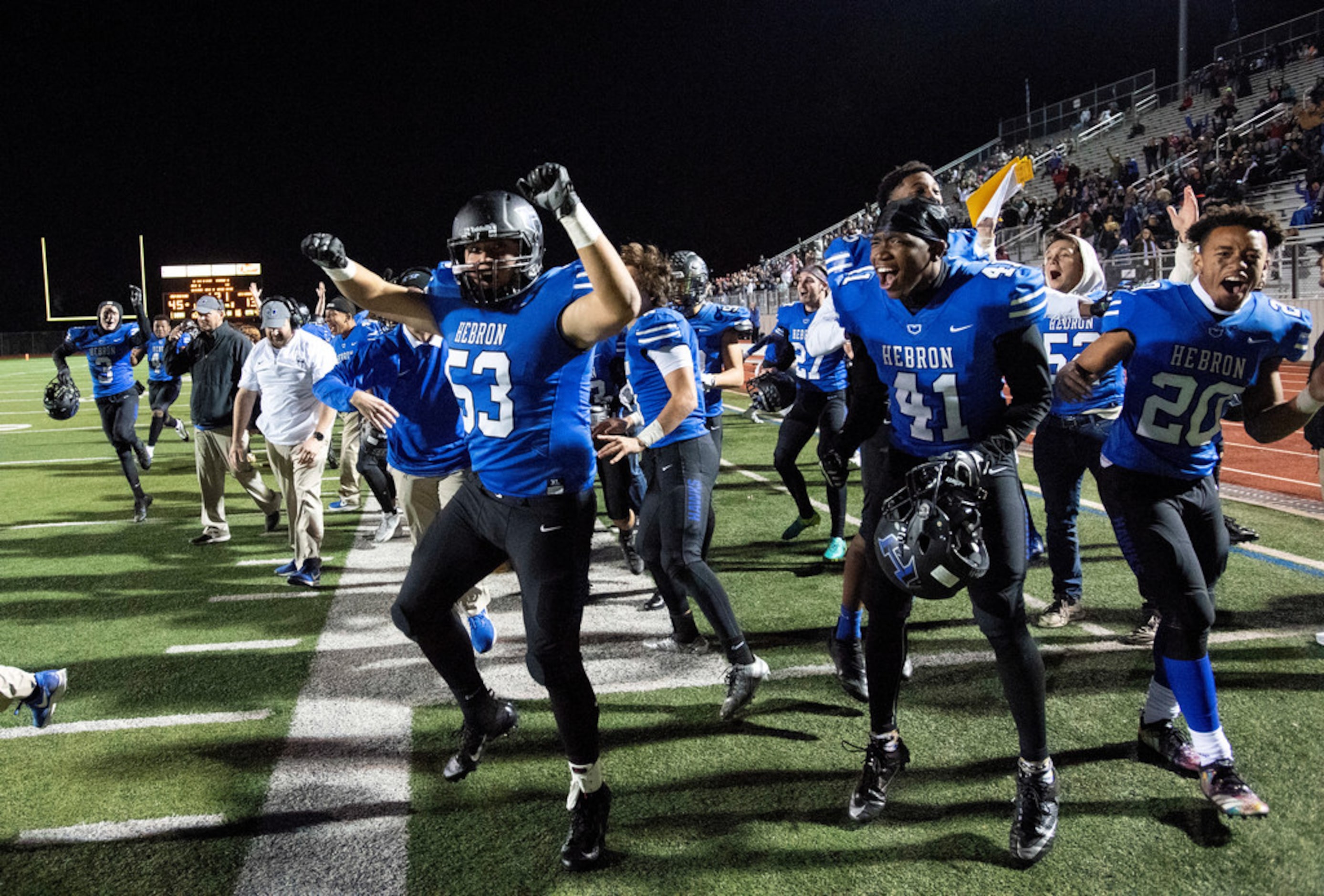 Hebron junior defensive lineman Ramiro Gamboa (53), senior linebacker Jonathan McHenry (41)...