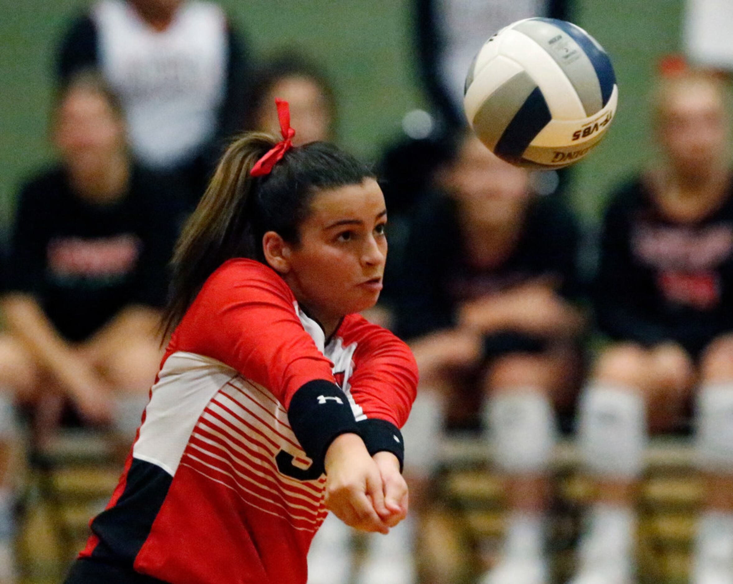 Lovejoy High School defensive specialist Callie Kemohah (3) passes the volleyball in game...