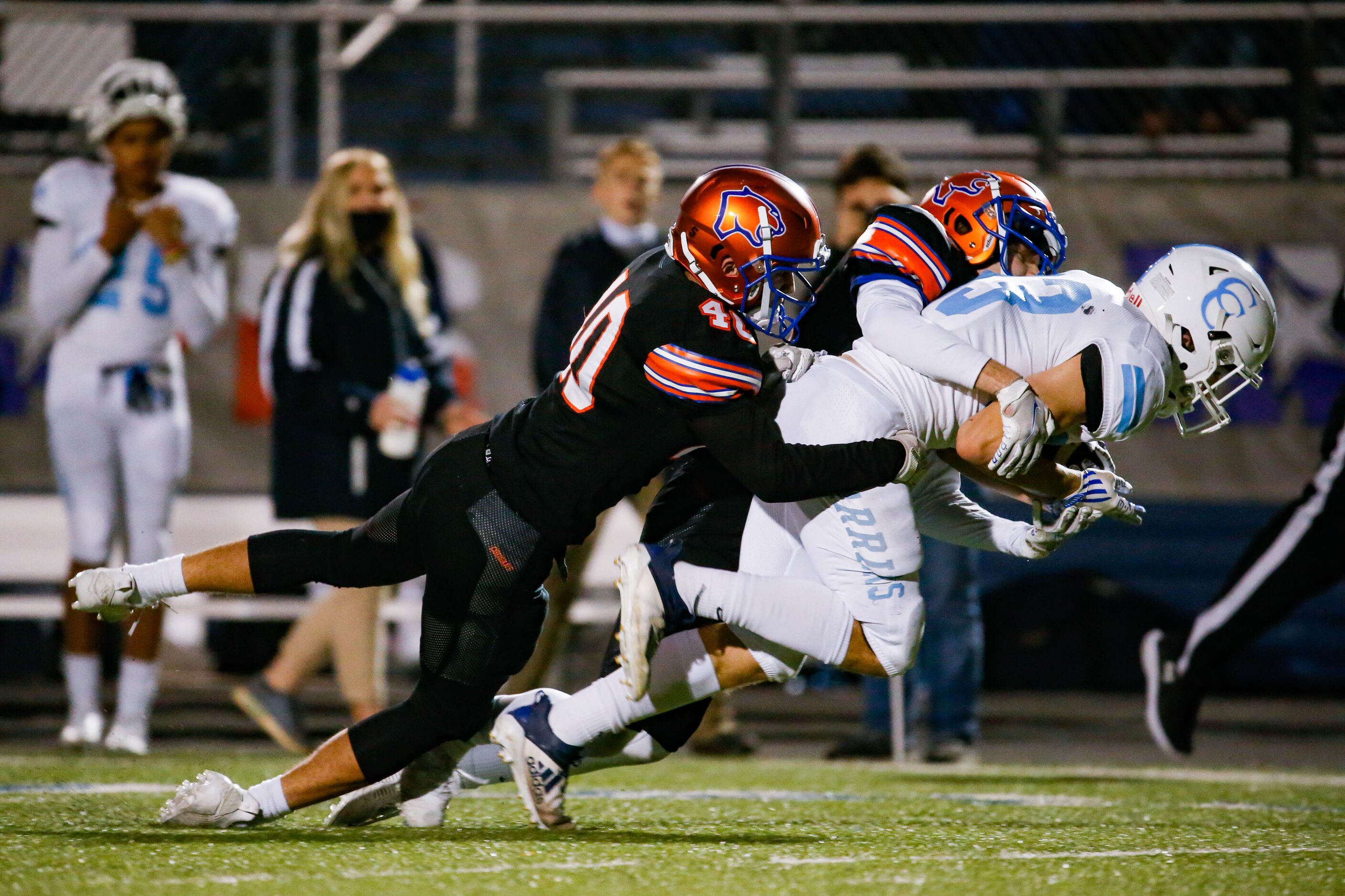 Cypress Christian's Cody Andrus is brought down by the Colleyville Covenant defense during...