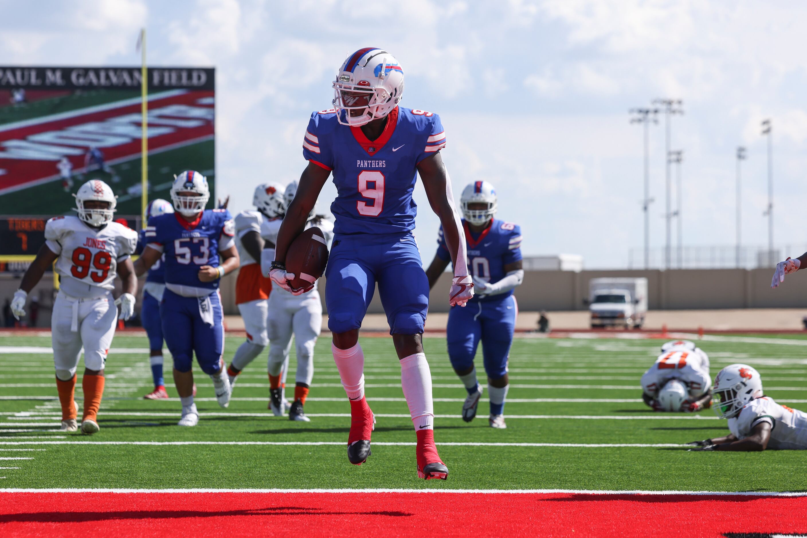 Duncanville High School Kaleb Kenney (9) jumps into the end zone scoring a touchdown during...