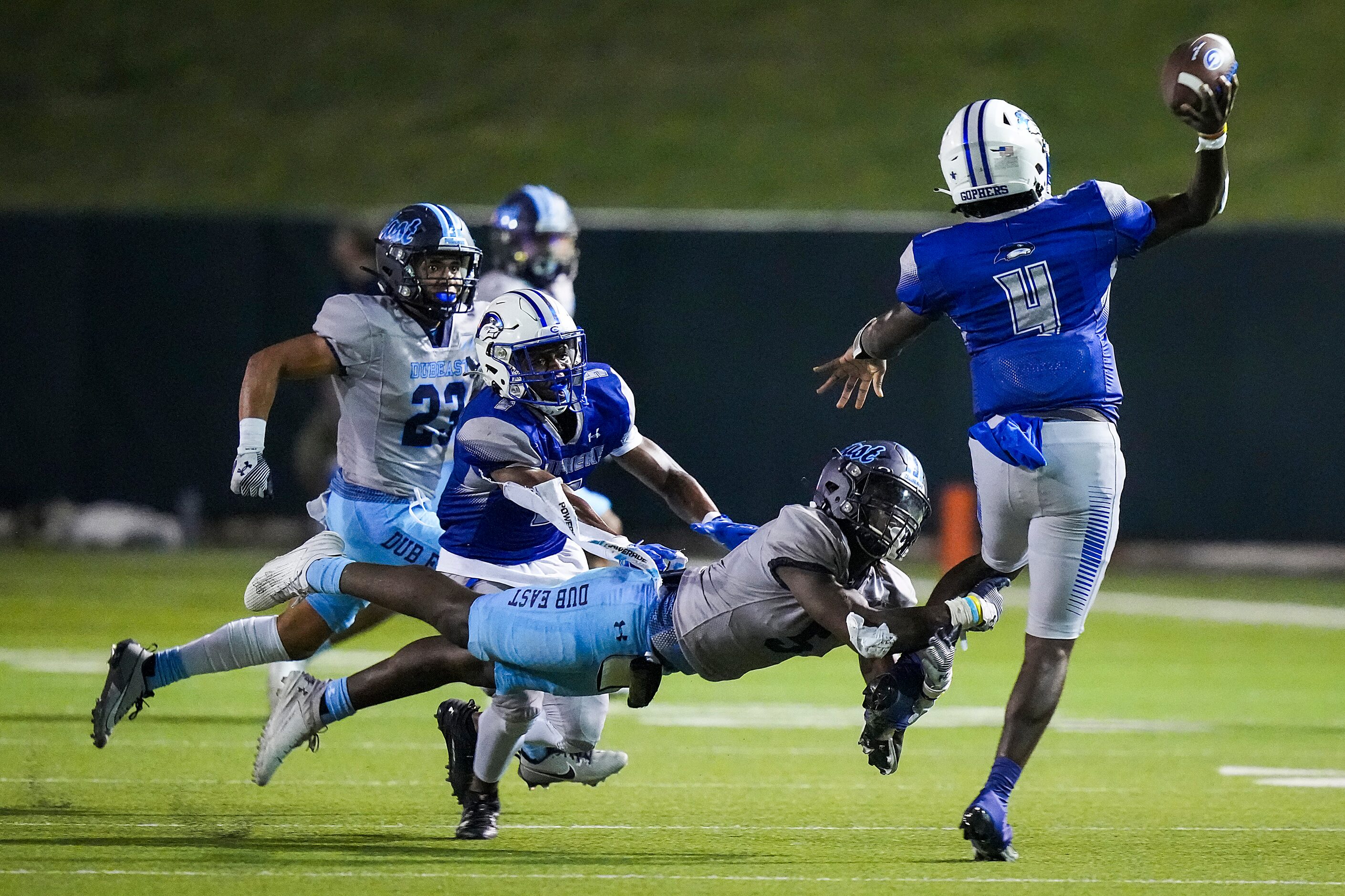 Grand Prairie quarterback Kaleb Harris (4) gets off a pass out of the grasp of Wylie East...