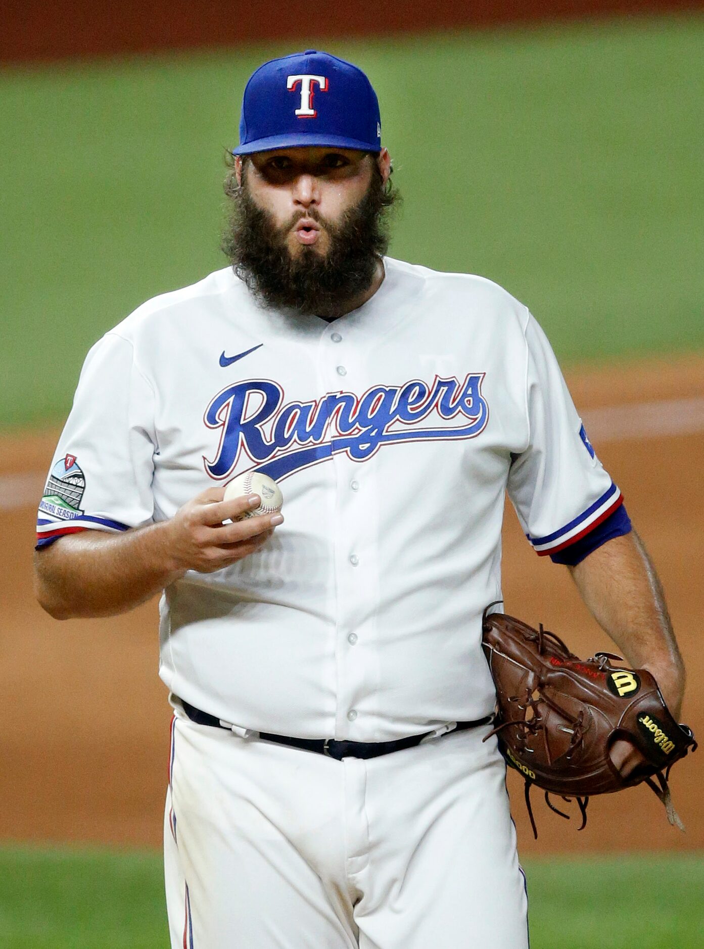 Texas Rangers starting pitcher Lance Lynn (35) reacts after striking out Oakland Athletics...