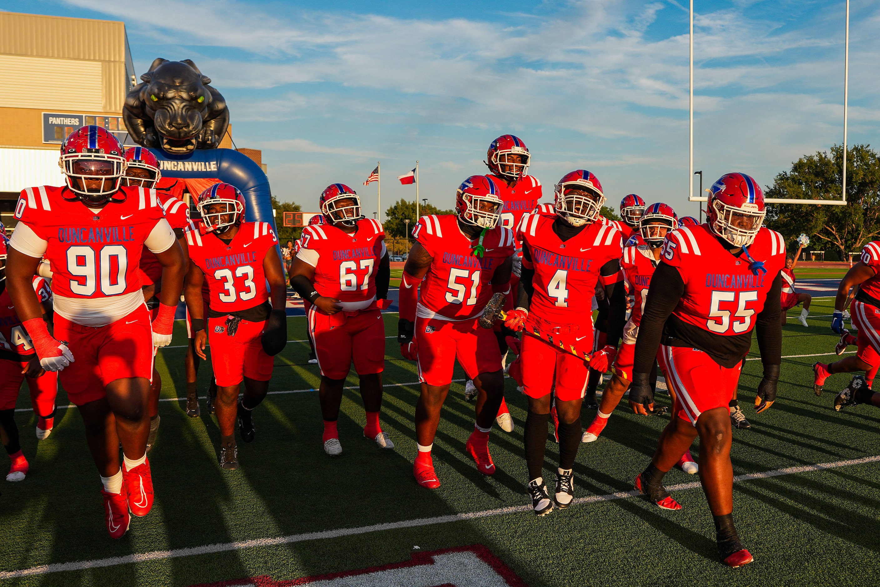 Duncanville players take the field before during a District 11-6A high school football game...