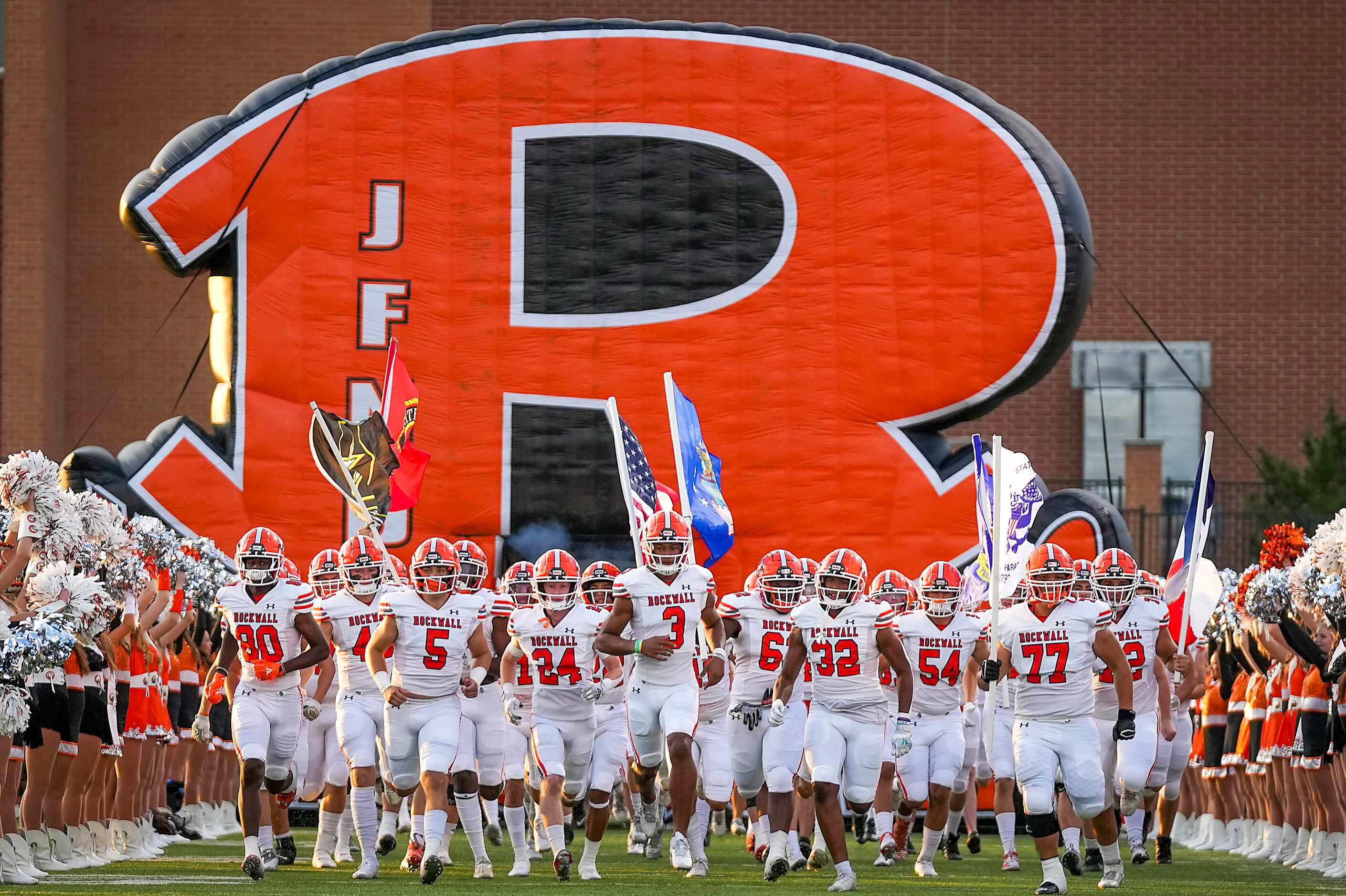 Rockwall players take the field before a District 10-6A high school football game against...