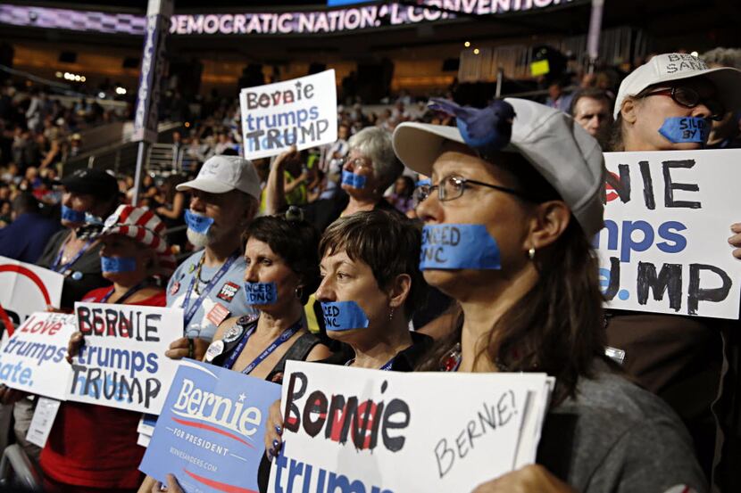 Bernie Sanders supporters silently protest during the Democratic National Convention on...