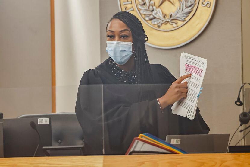 State District Judge Amber Givens asks Dallas Police detectives about evidence during a...
