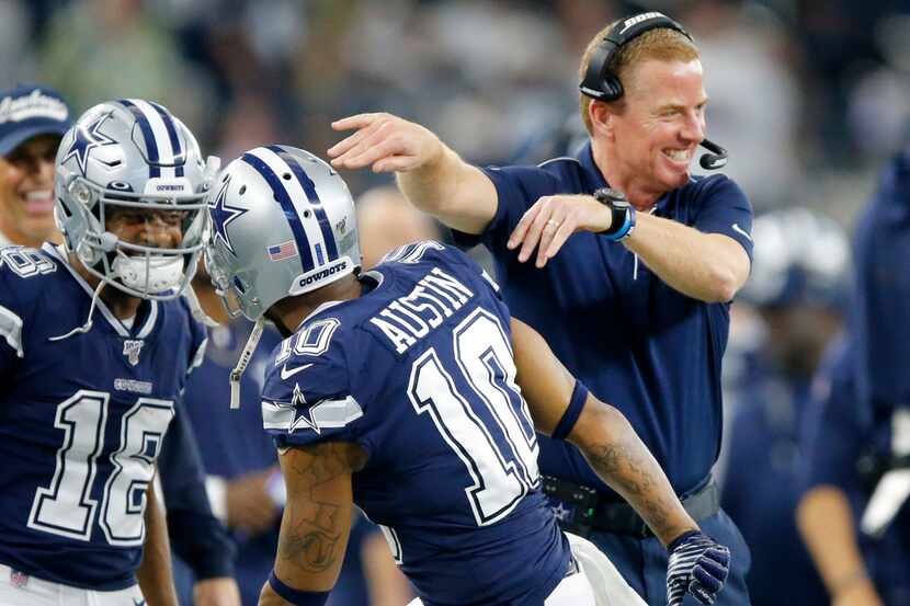 Dallas Cowboys head coach Jason Garrett congratulates wide receiver Tavon Austin (10) after...