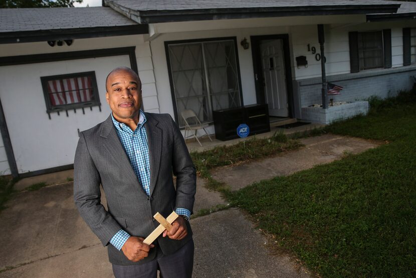 Emmanuel Lewis, standing in front of his Irving home, has seen his house's value increase...