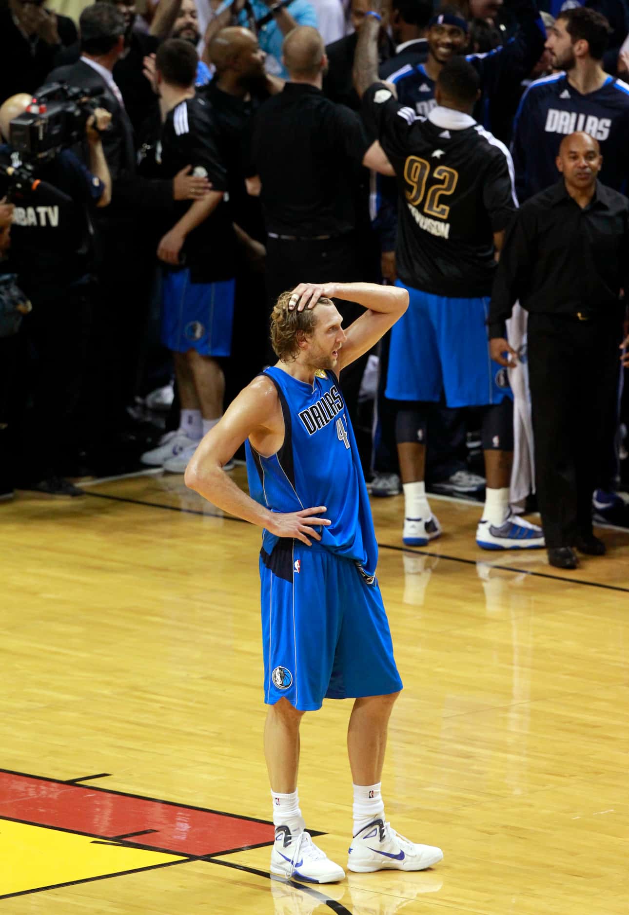 Dallas Mavericks power forward Dirk Nowitzki (41) stands alone after winning game six of the...