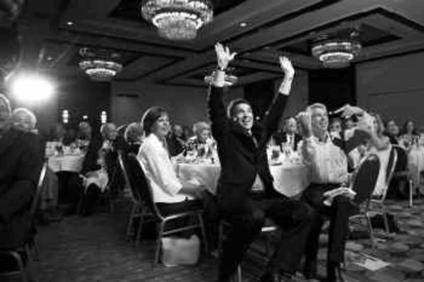 Gov. Rick Perry greeted the crowd at a Texas Eagle Forum banquet on Thursday night in Dallas.