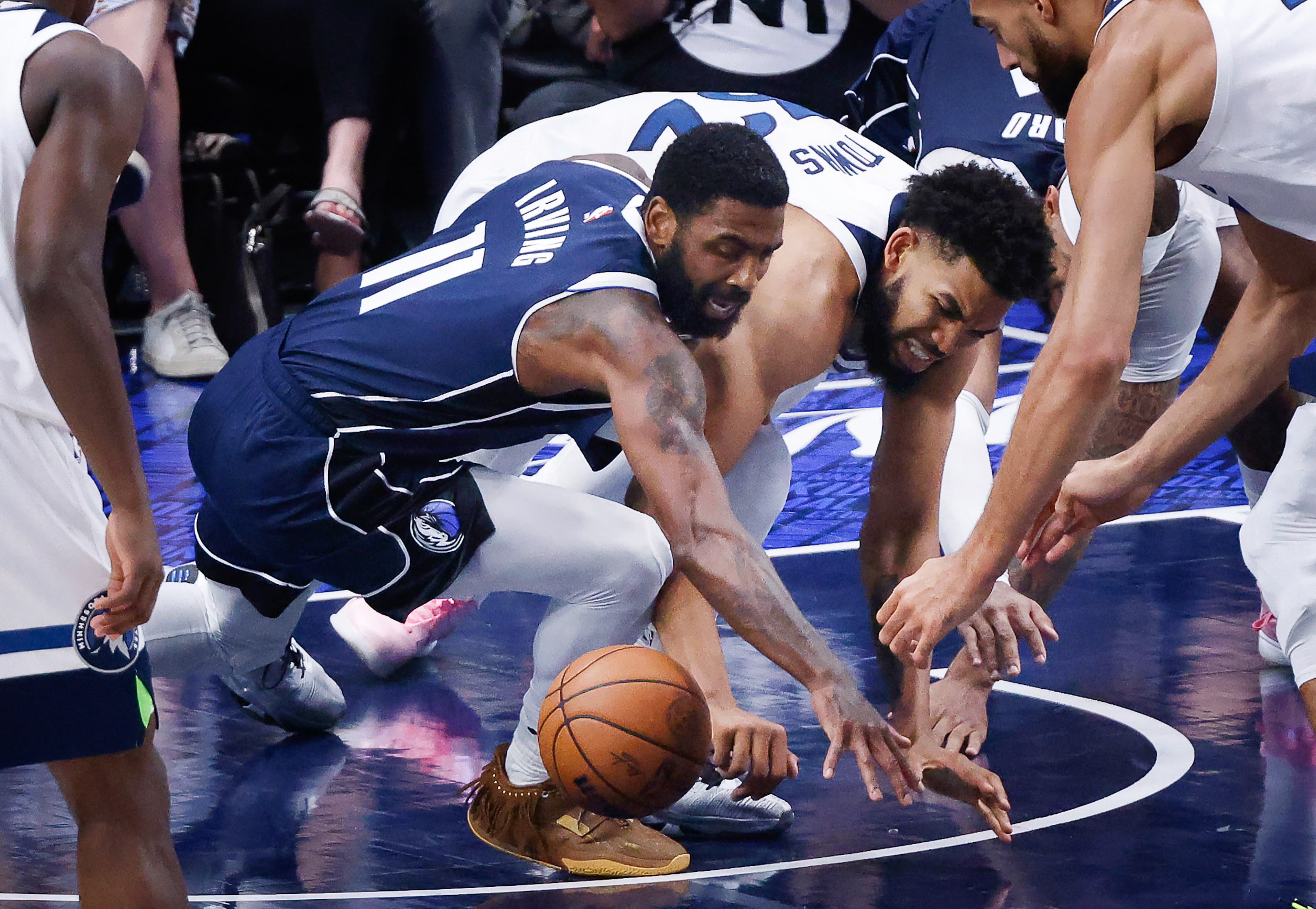 Dallas Mavericks guard Kyrie Irving (11) and Minnesota Timberwolves center Karl-Anthony...