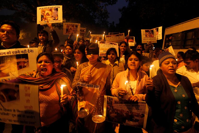 Indians take part in a candlelight vigil in New Delhi, India, Sunday, Jan. 13, 2013. Police...