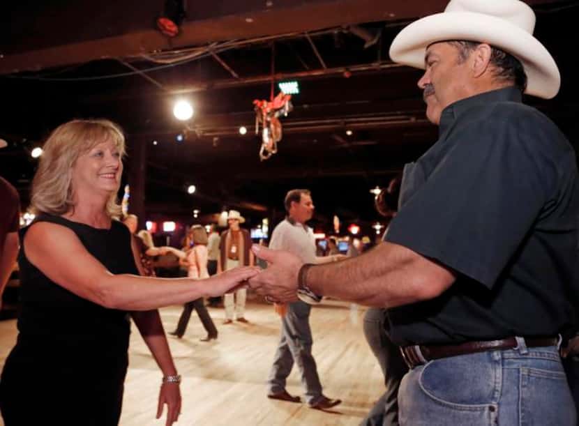 Cliff and Lee Ann Morris  dance during a class led by Wendell Nelson at Billy Bob’s. Cliff...