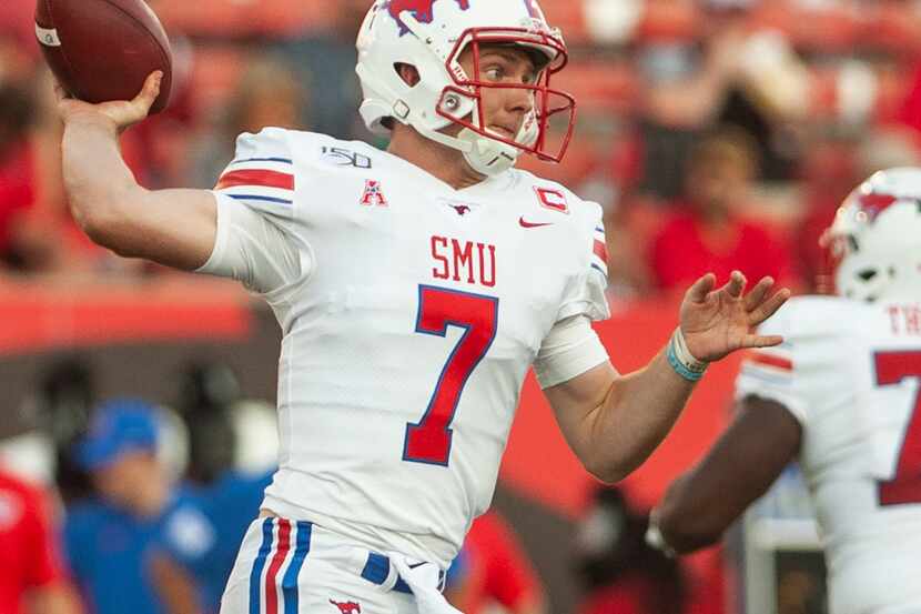 SMU quarterback Shane Buechele drops back for a pass attempt during the first half against...