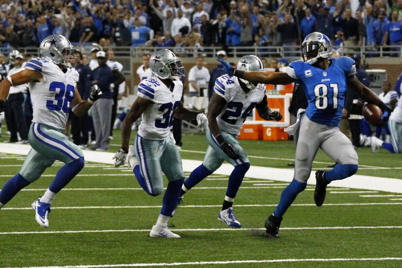 Detroit Lions wide receiver Calvin Johnson (81) tries to outrun Dallas Cowboys cornerback...