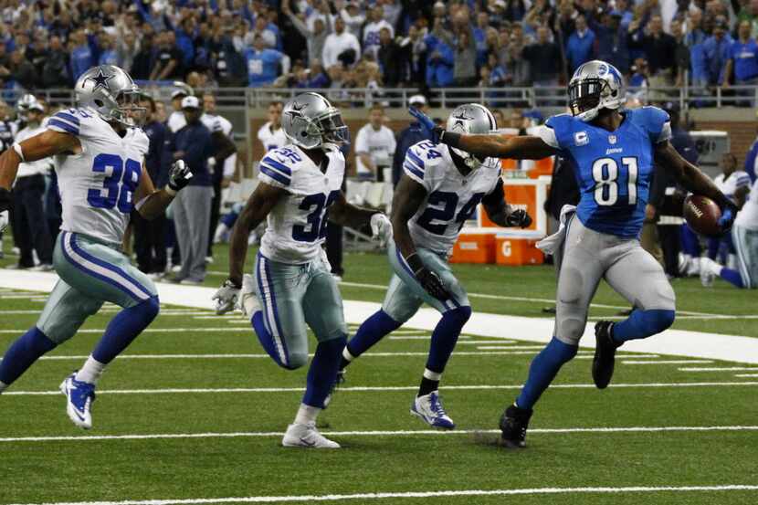 Detroit Lions wide receiver Calvin Johnson (81) tries to outrun Dallas Cowboys cornerback...