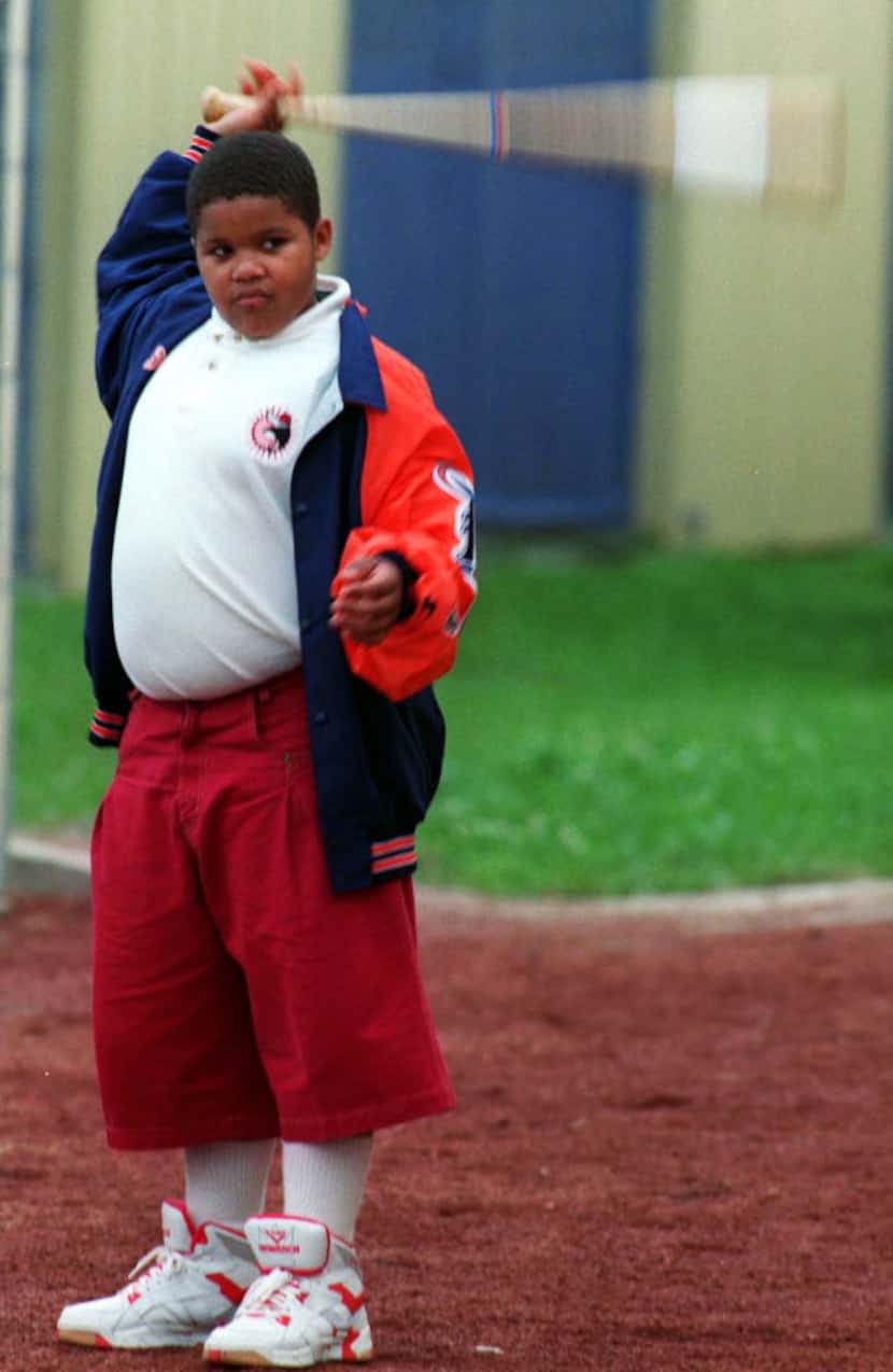 In this 1994 photo, Prince Fielder, son of Detroit Tigers' Cecil Fielder, swings a bat at...
