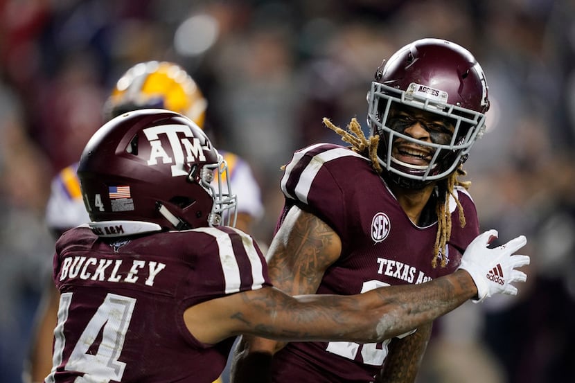 Texas A&M wide receiver Kendrick Rogers, right, celebrates with Camron Buckley (14) after...