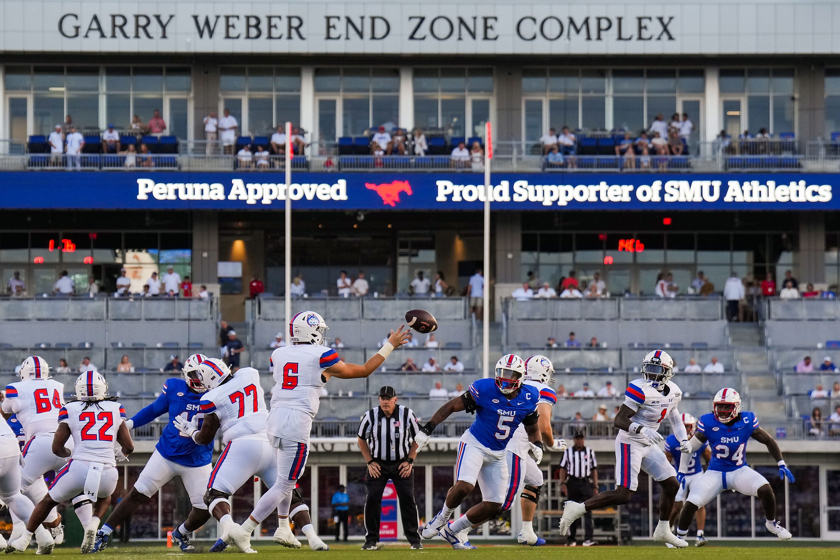 Houston Christian quarterback Cutter Stewart (6) throws a pass under pressure fromn SMU...