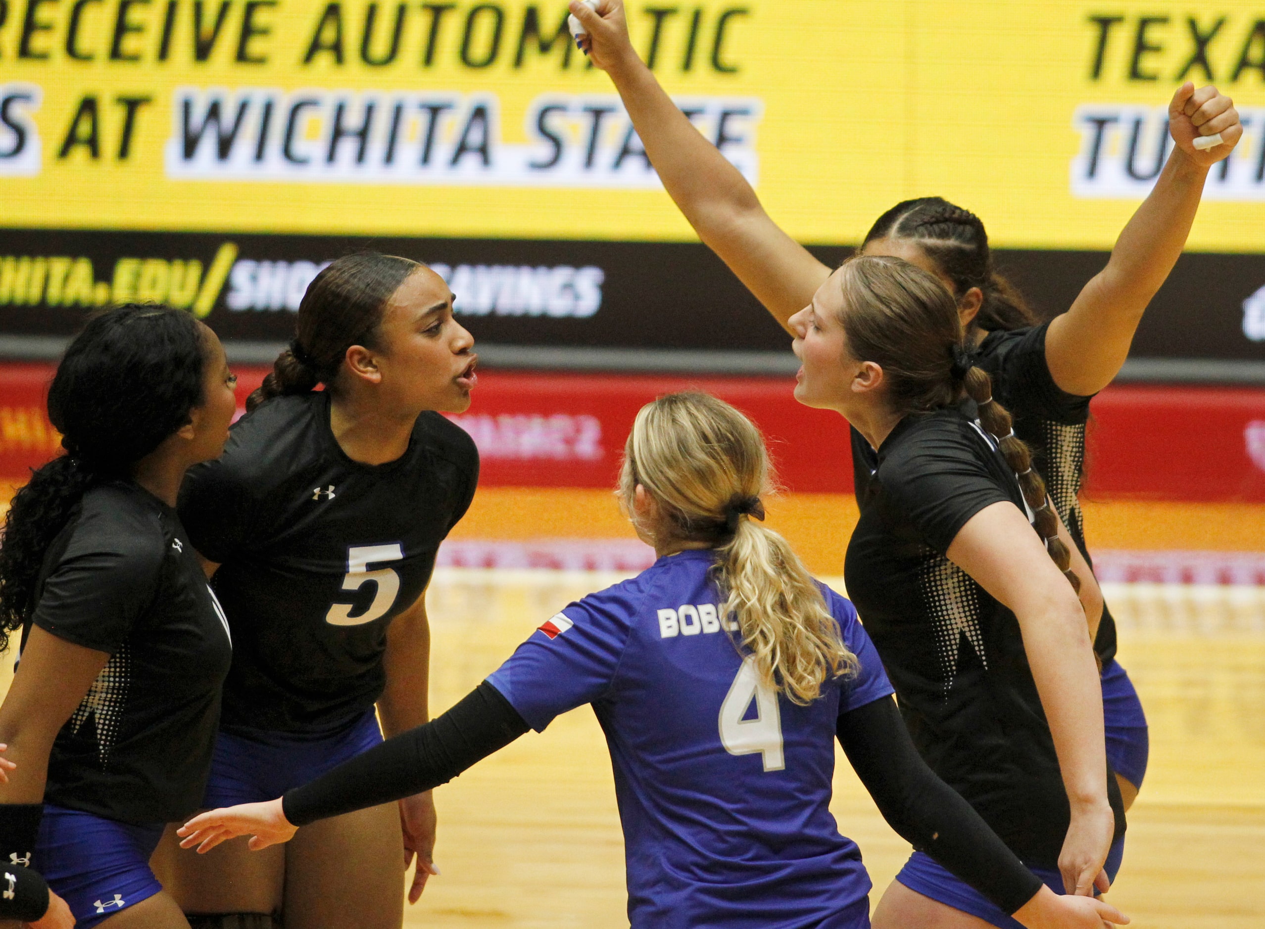 Byron Nelson outside hitter Sydnee Peterson (5), 2nd from left, ignited an enthusiastic...