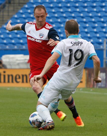 FC Dallas' Anton Nedyalkov (6) attempts to maneuver the ball around the defense of Seattle...