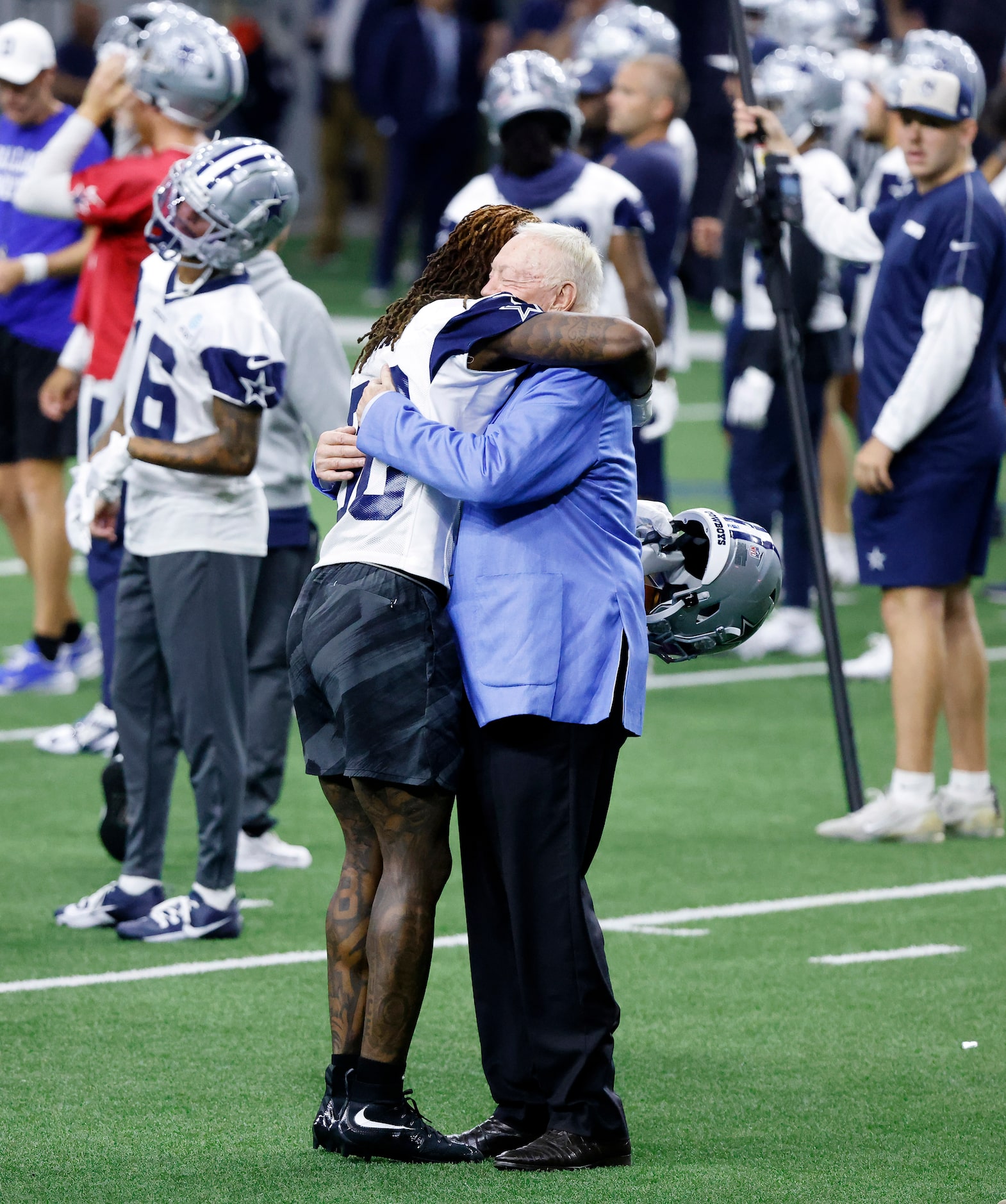 Newly signed Dallas Cowboys wide receiver CeeDee Lamb (88) and owner Jerry Jones embrace one...