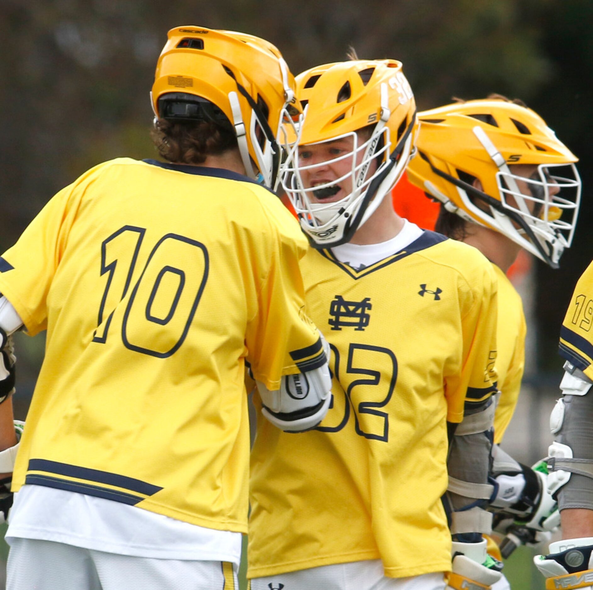 St. Mark's attackman Lyle Ochs (32) was all smiles as he is congratulated with teammate Ian...