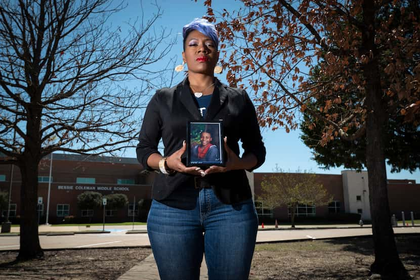 Donna Fields, holding a photo of son Marcus Bell Jr. when he was 12, stands outside Bessie...