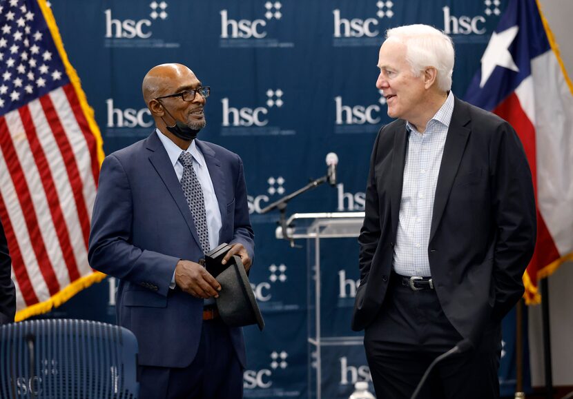 DNA Exoneree Johnny Pinchback (left) visits with United States Senator John Cornyn of Texas...