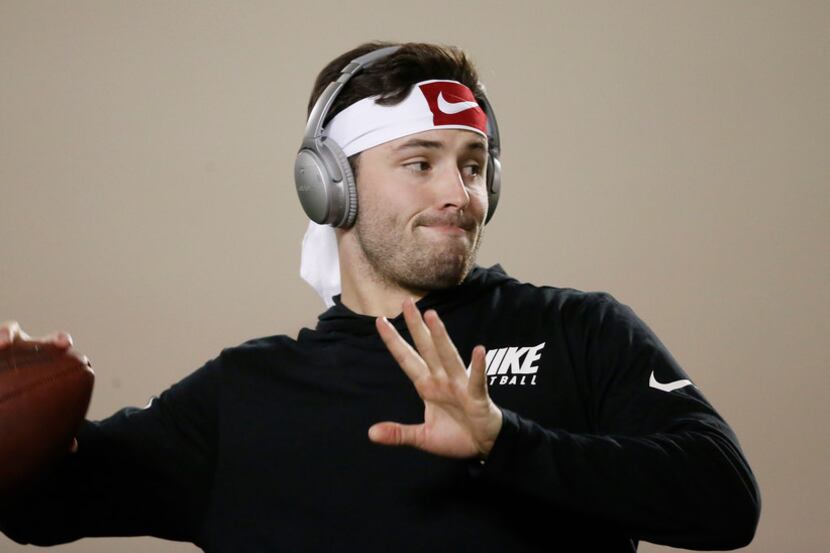 Oklahoma quarterback Baker Mayfield warms up for his pro day workout in Norman, Okla., on...