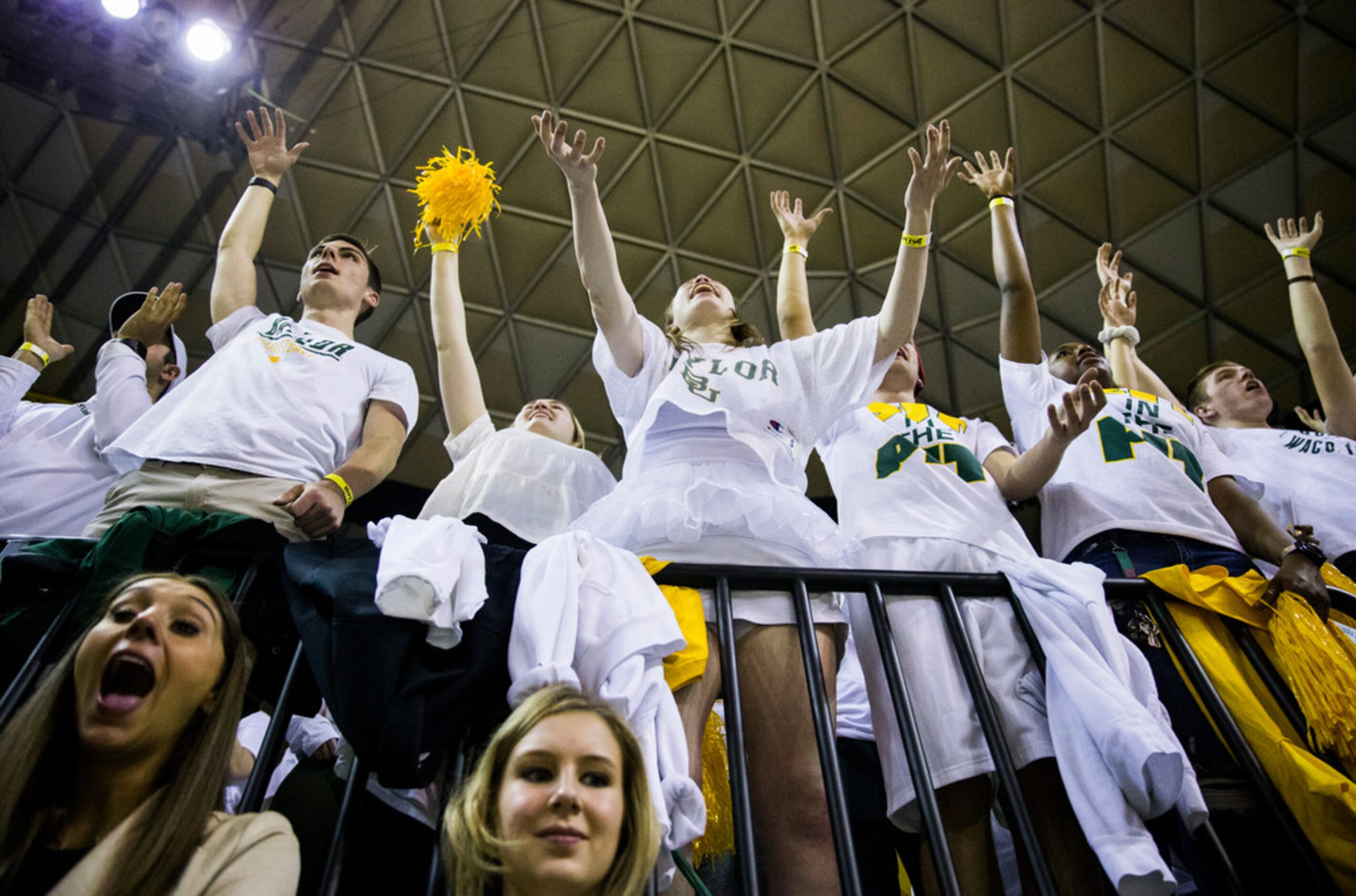 Baylor Bears fans cheer during the first half of an NCAA men's basketball game between...