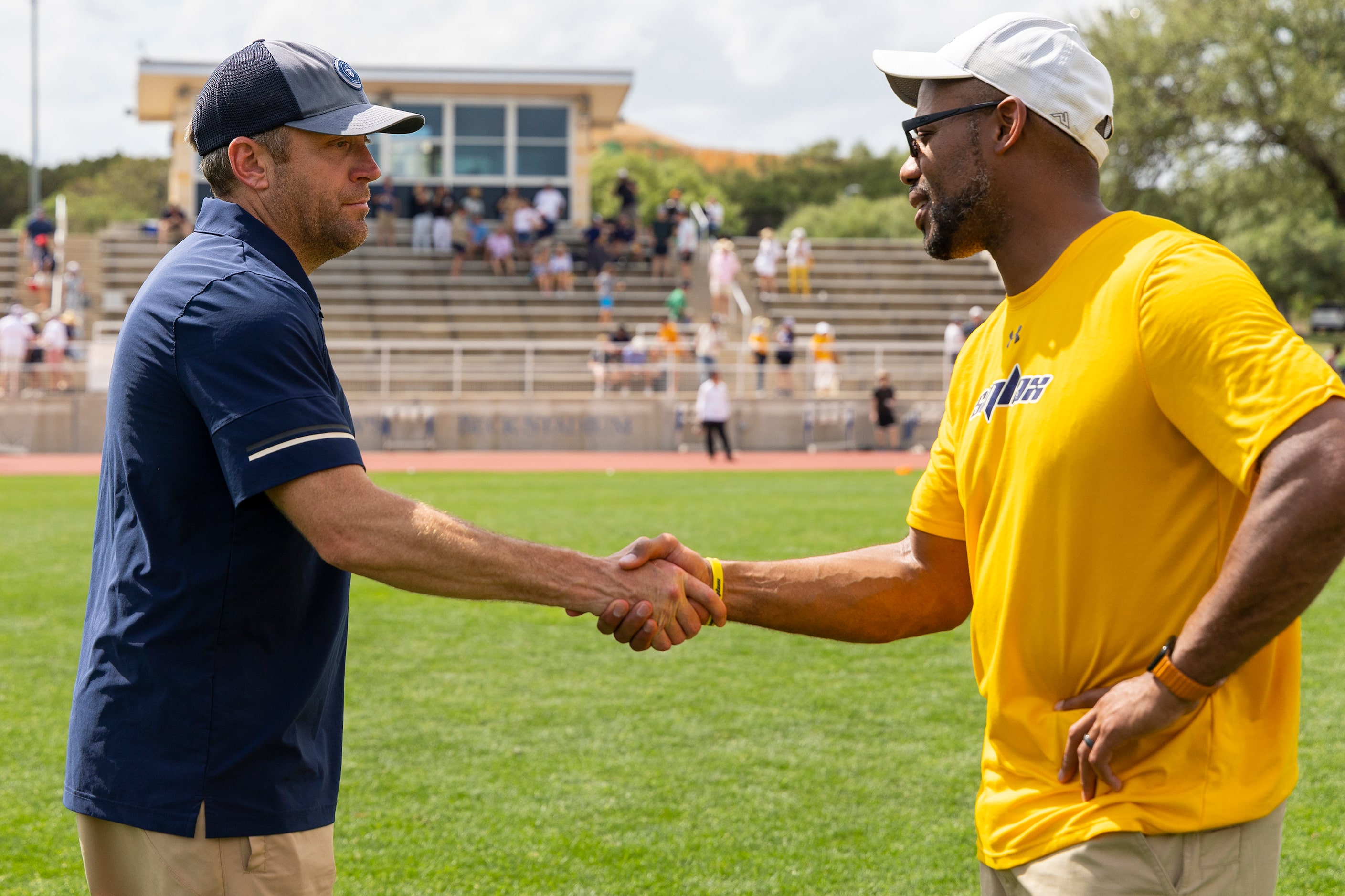 Episcopal School of Dallas head coach Jay Sothoron greets St. Mark's head coach Jason Leneau...