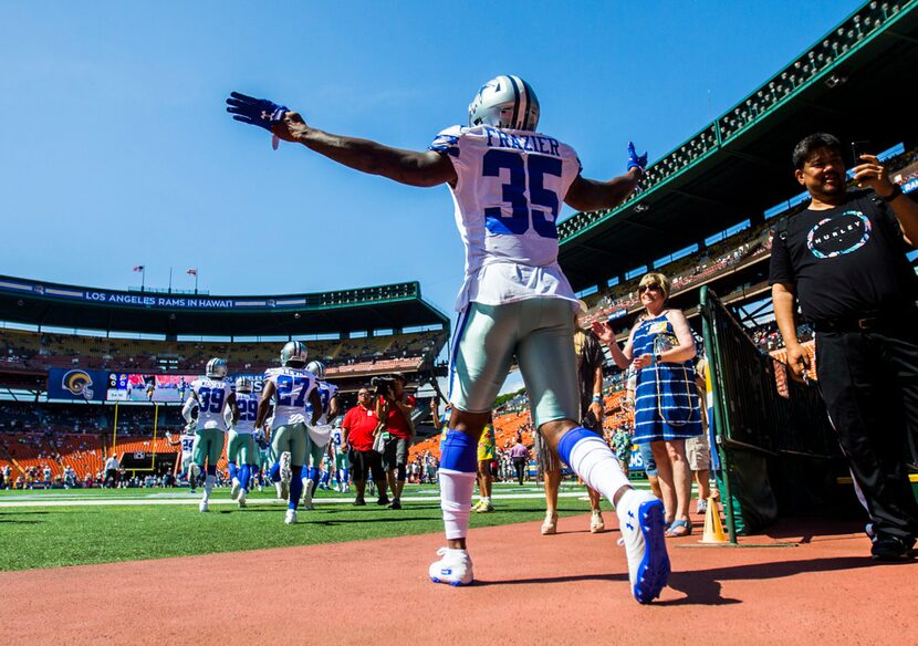 Dallas Cowboys free safety Kavon Frazier (35) runs out to warm up before an NFL preseason...