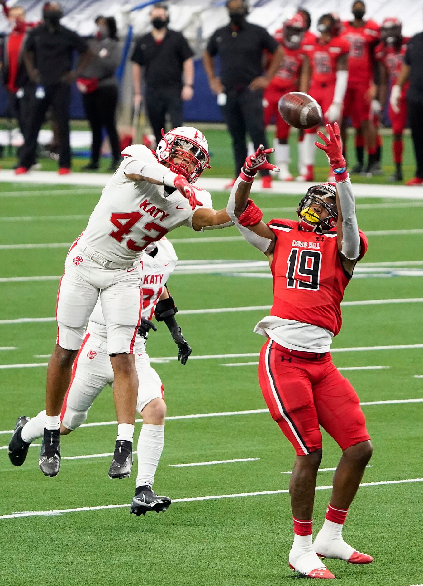 Katy defensive back Dalton Johnson (43) breaks up a pass intended for Cedar Hill wide...