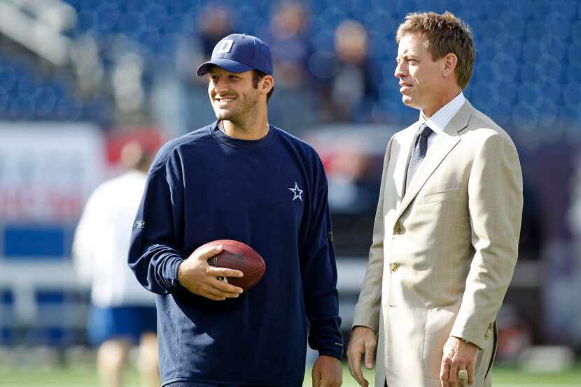 Tony Romo (talks with Fox sports announcer Troy Aikman (right) before a game against the New...