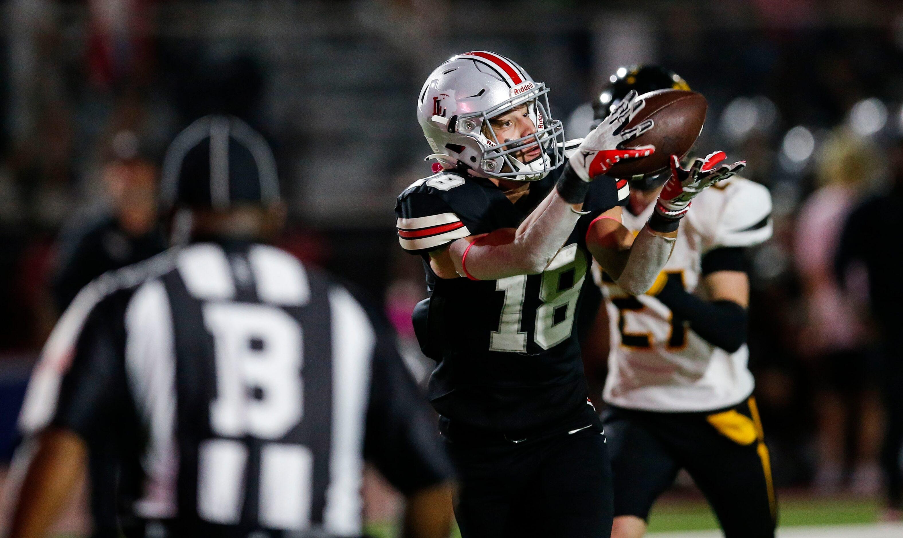 Lovejoy sophomore wide receiver Parker Livingstone (18) catches a pass and runs it in for a...