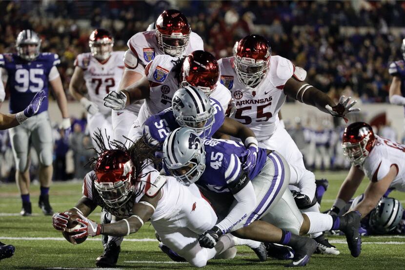 Arkansas running back Alex Collins dives over the goal line to score a touchdown on a...