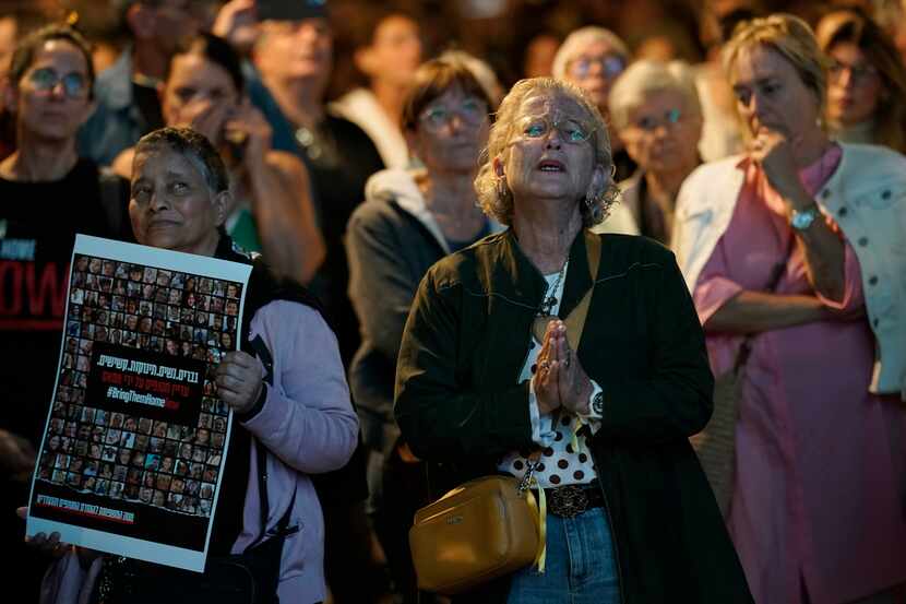 People participate in a show of solidarity with hostages being held in the Gaza Strip, near...