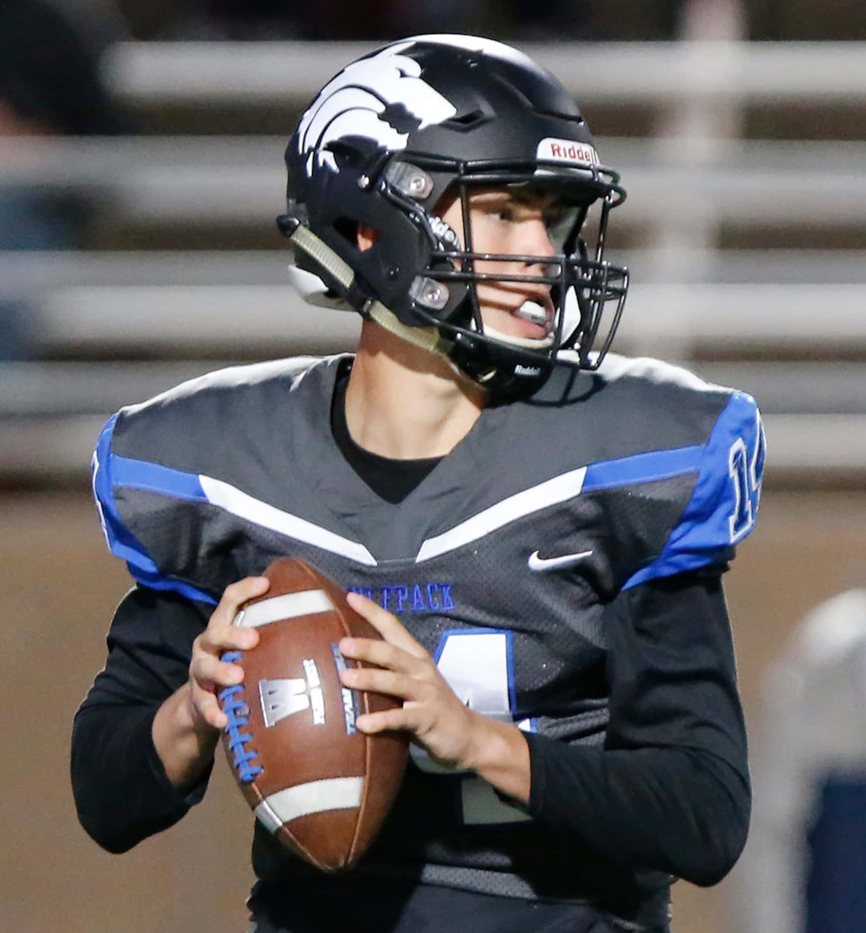 Plano West High School Andrew Picco (14) looks to pass during the first half as Plano West...