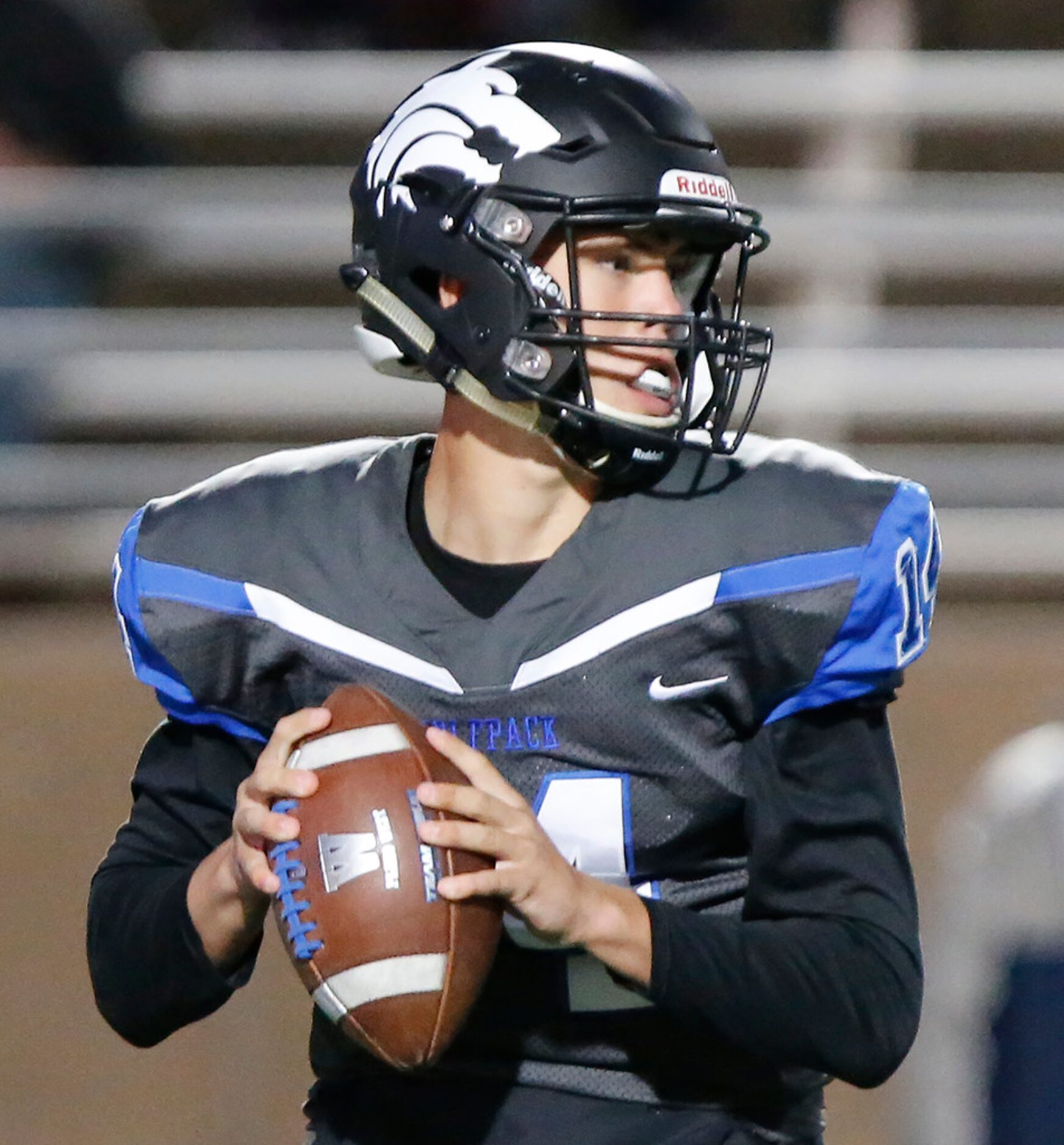 Plano West High School Andrew Picco (14) looks to pass during the first half as Plano West...