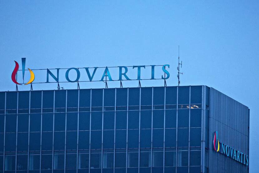 The Novartis AG Logo sits on top of the company's headquarters office in Basel, Switzerland,...