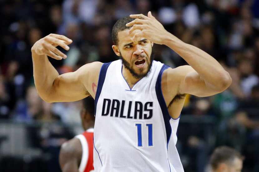 Dallas Mavericks center JaVale McGee (11) gets the crowd in the game after his second half...