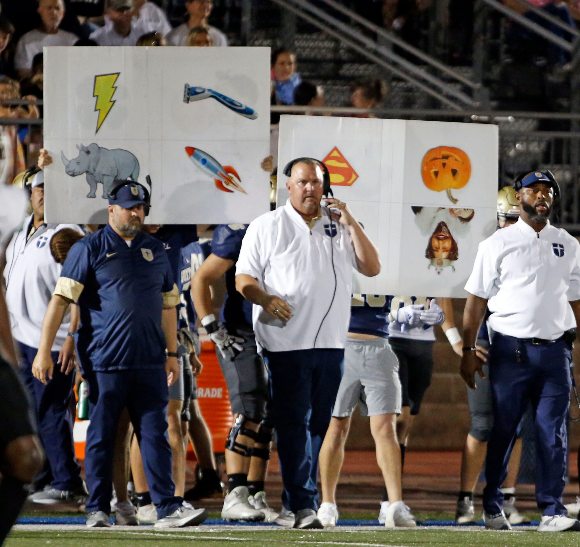 Cryptic sign behind the Jesuit high coaches send commands to the team’s offense during the...