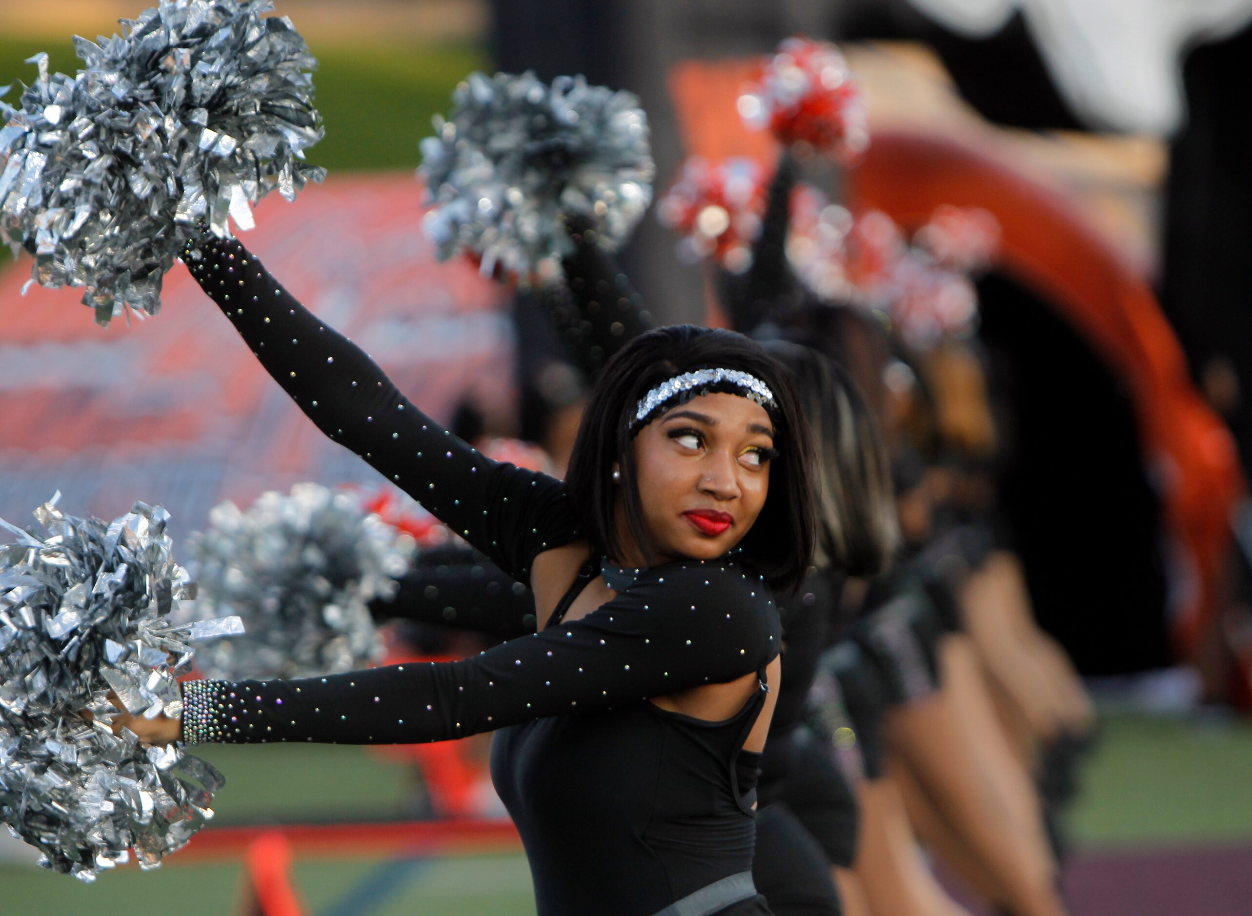 Lancaster drill team members perform on the field just prior to team introductions before...