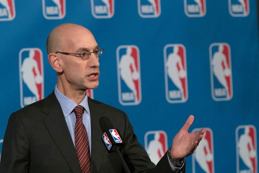 FILE - In this Oct. 21, 2016, file photo, NBA Commissioner Adam Silver speaks to reporters...