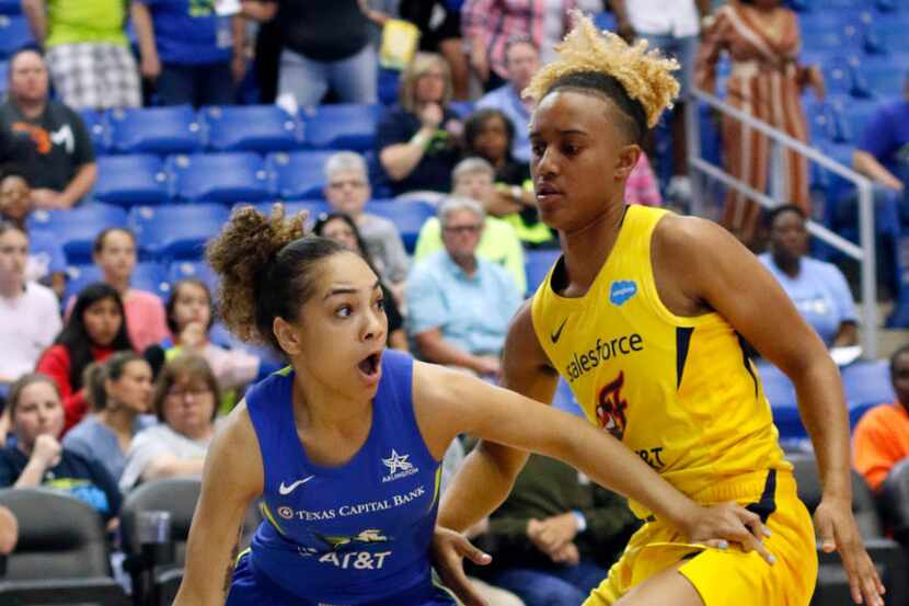 Dallas Wings guard Brooke McCarty-Williams (1) dribbles baseline against the defense of...