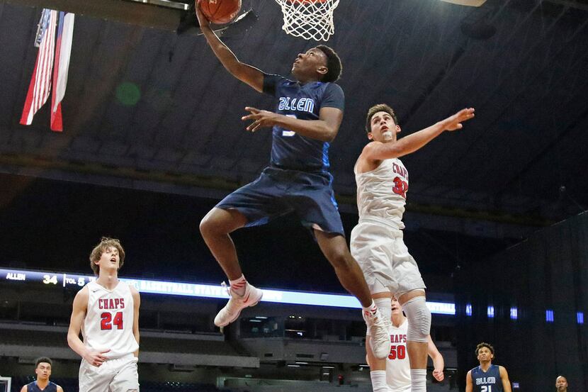 Allen's Isaiah Stevens drives for two from Friday's Class 6A boys basketball UIL state...